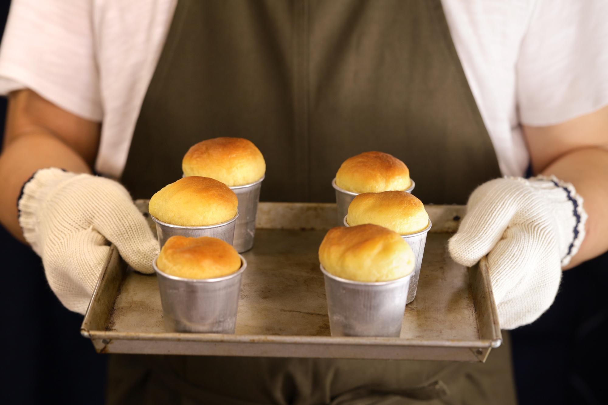 making rum baba ( baba au rhum ), traditional French and Italian dessert