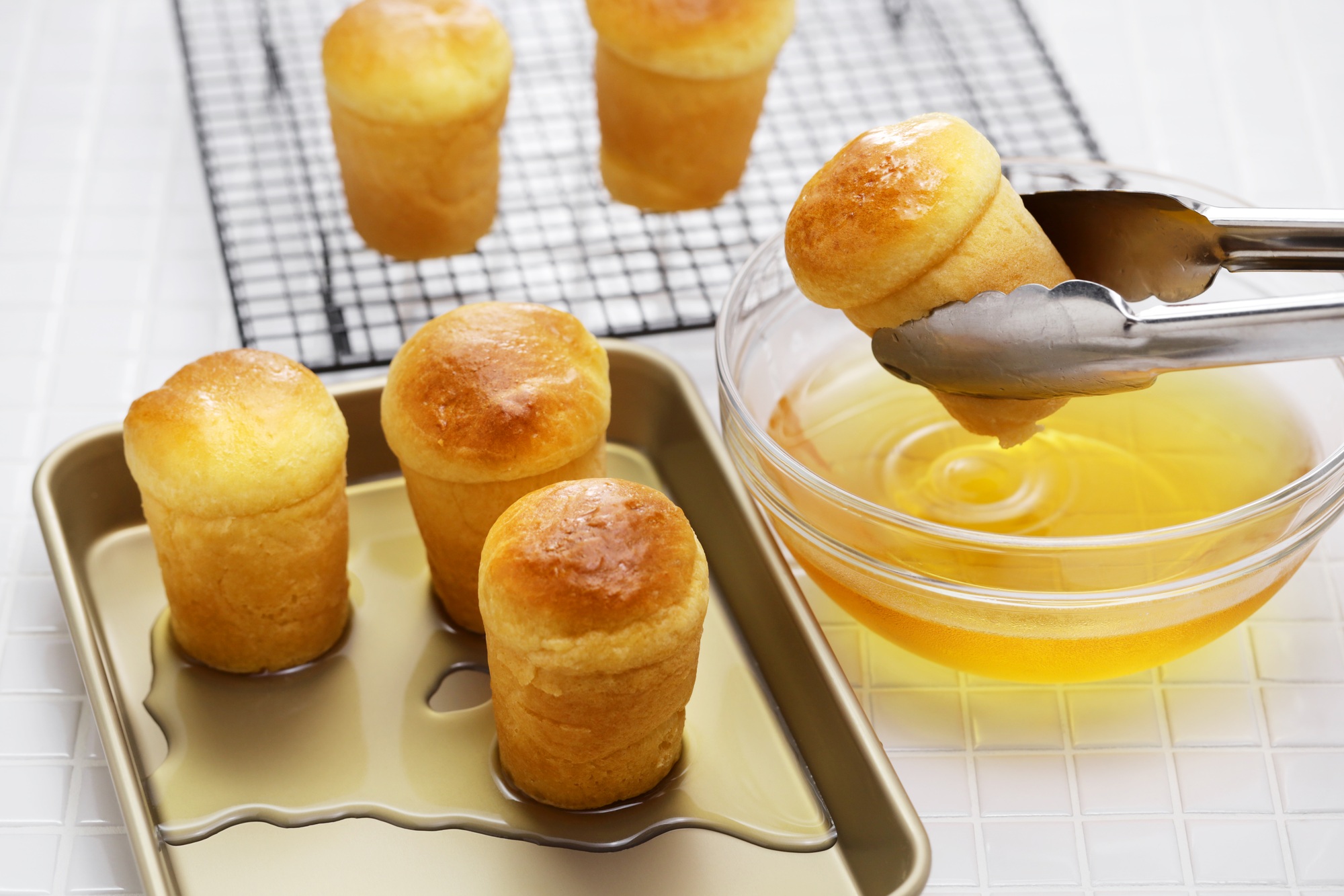 making rum baba ( baba au rhum ), traditional French and Italian dessert
