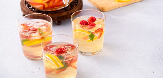 Summer sangria punch in a pitcher and glasses