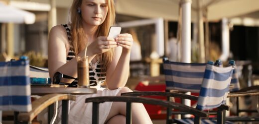 Woman sending an sms on her mobile