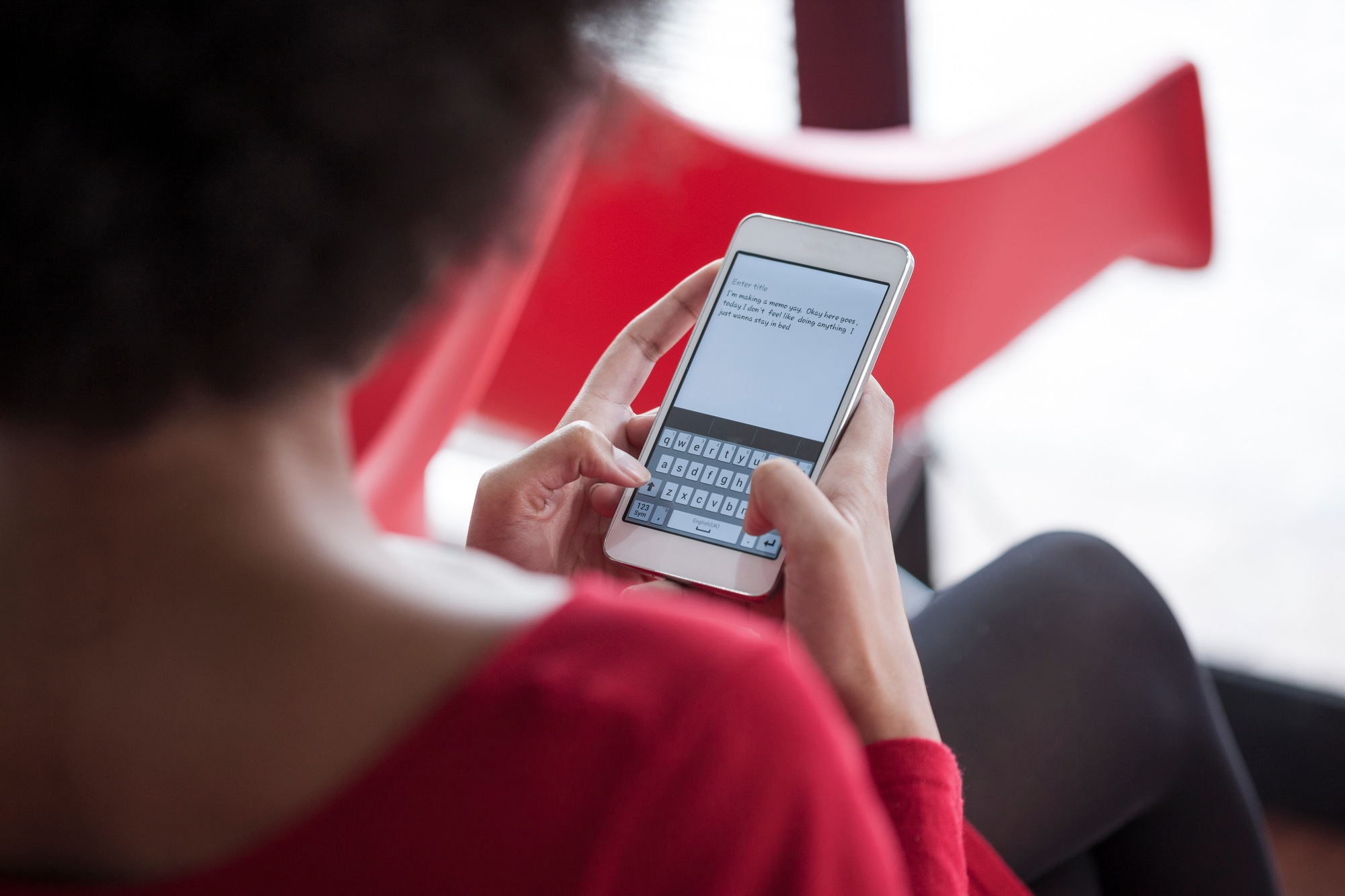 Woman text messaging on cell phone